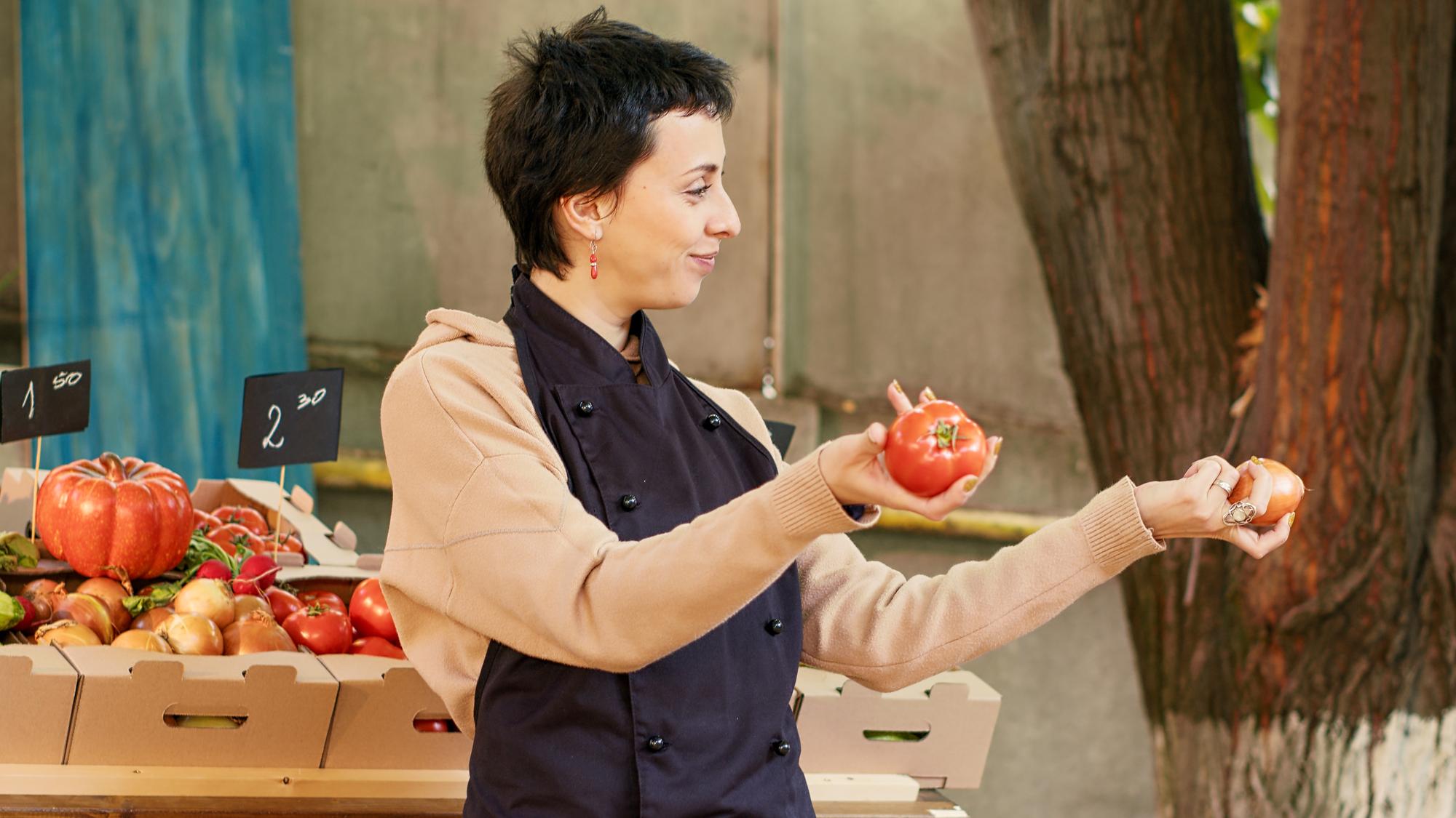 Chef sourcing produce at local market